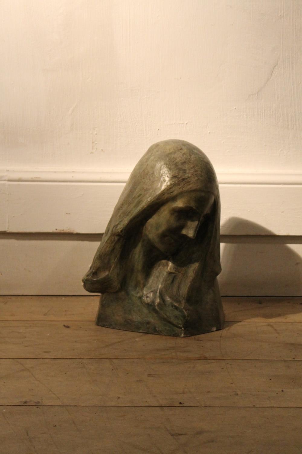 green plaster figure